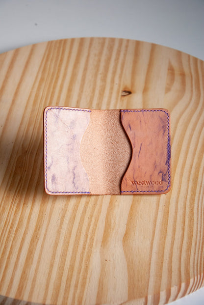 Cardholder with marbled design on a wooden surface